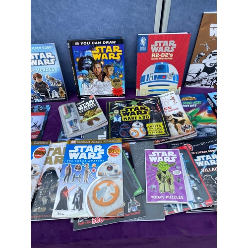 542 - A collection of Star Wars Sticker / colouring / reference books + others