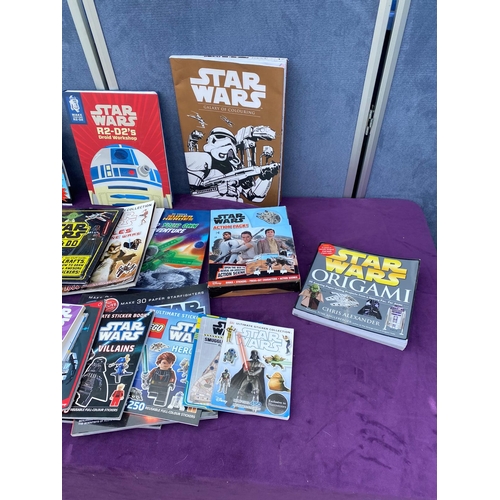 542 - A collection of Star Wars Sticker / colouring / reference books + others