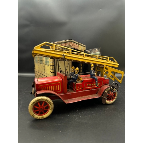 252 - A Distler tinplate clockwork Fire Engine J.D.1614 + Fire Station , German circa 1930 -  lithographed... 