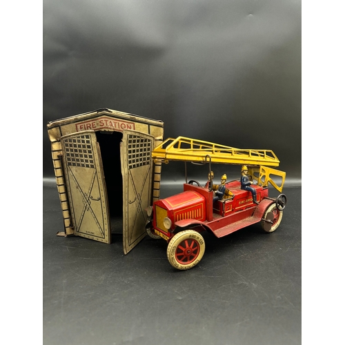 252 - A Distler tinplate clockwork Fire Engine J.D.1614 + Fire Station , German circa 1930 -  lithographed... 