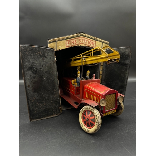 252 - A Distler tinplate clockwork Fire Engine J.D.1614 + Fire Station , German circa 1930 -  lithographed... 