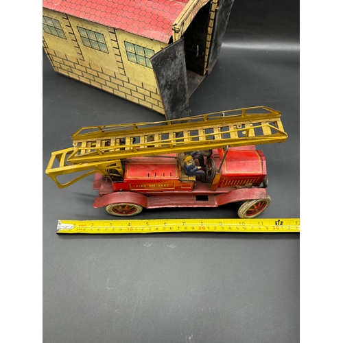 252 - A Distler tinplate clockwork Fire Engine J.D.1614 + Fire Station , German circa 1930 -  lithographed... 