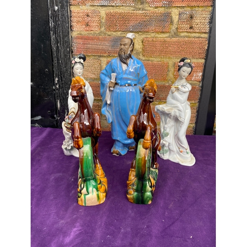 116 - A collection of oriental inspired ceramic figures