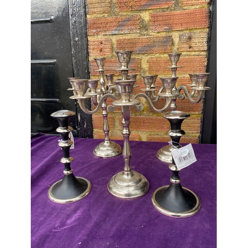 119 - Two sets of candle stick holders.