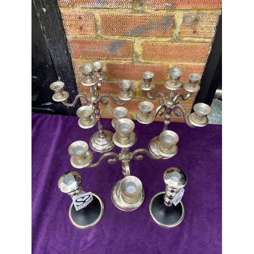 119 - Two sets of candle stick holders.