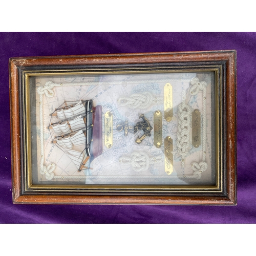 129 - Two Naval themed framed key storage boxes.