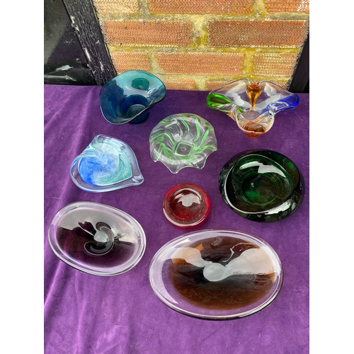 133 - A collection of coloured glass bowls/trays.