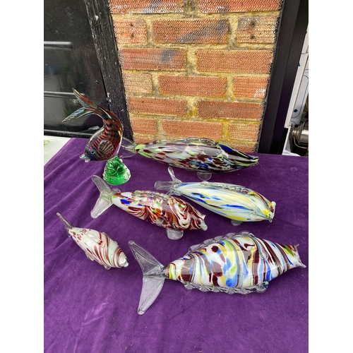 134 - A collection of interesting coloured glass fish.