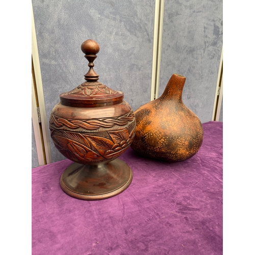 151 - Two hand carved wooden vessels.