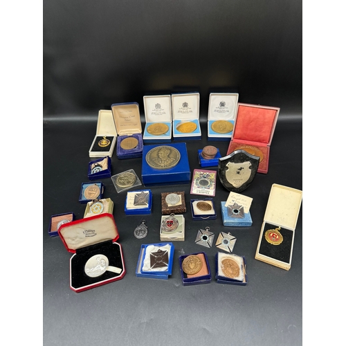 56 - Collection of metal and bronze athletics medallions including Jean Giraudoux 1944 bronze medallion c... 