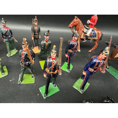 292 - Britains Hollow cast various regiments + mounted officers Naval Riflemen