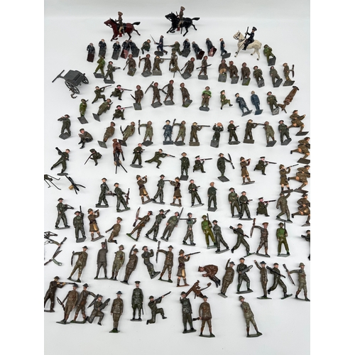 313 - Large quantity of Britains Hollow Cast WW1 & WW2 Infantry, Officers , accesories