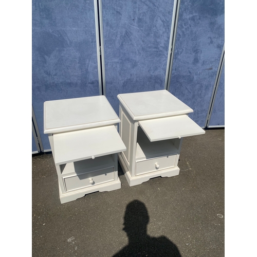 193 - A pair of modern white bedside tables with pull out ledge and storage draw. 

Dimensions - 26