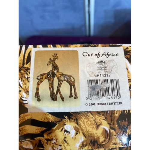 209 - A collection of new in the box/ Unused items including Giraffe ornament