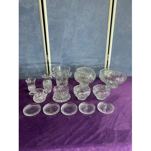 230 - A collection of crystal vases and place matts including Harrods