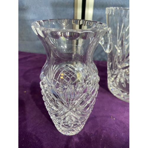 230 - A collection of crystal vases and place matts including Harrods