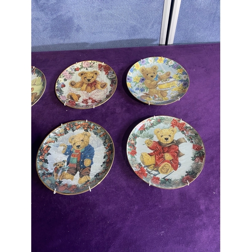 232 - Seven Franklin mint collectable plates and a set of four gourmet cheese plates.