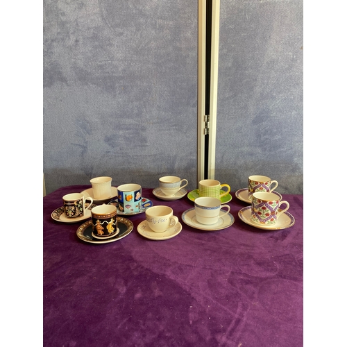 248 - A quantity of collectable cups and saucers including Gucci, Villeroy & Boch