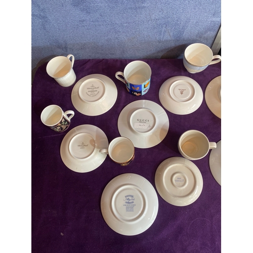 248 - A quantity of collectable cups and saucers including Gucci, Villeroy & Boch