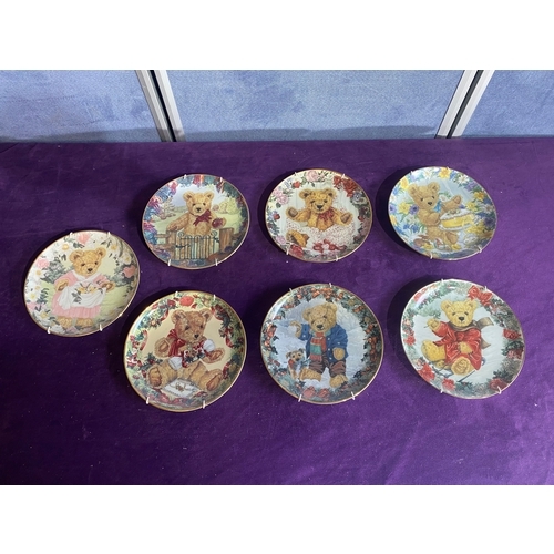 232 - Seven Franklin mint collectable plates and a set of four gourmet cheese plates.