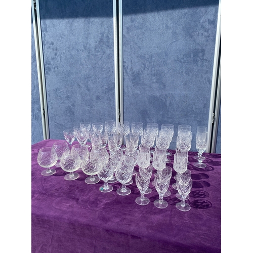 81 - A collection of crystal wine glasses.