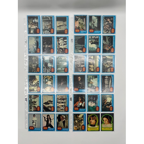 568 - Complete Topps Star Wars Series 1 - 5 Collectable cards complete with stickers and resealed wax pack... 