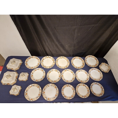 455 - A collection of Gillson ware ceramic plates and lids.