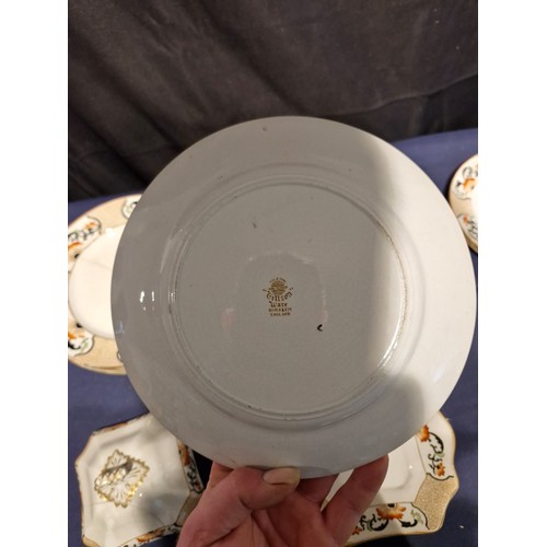 455 - A collection of Gillson ware ceramic plates and lids.