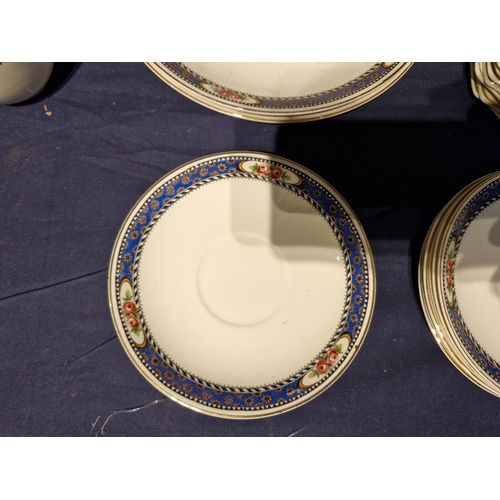 461 - Matching ceramic set with cups and saucers.