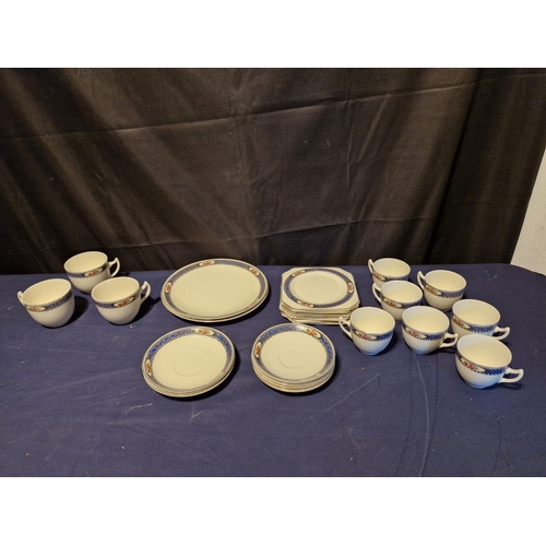 461 - Matching ceramic set with cups and saucers.