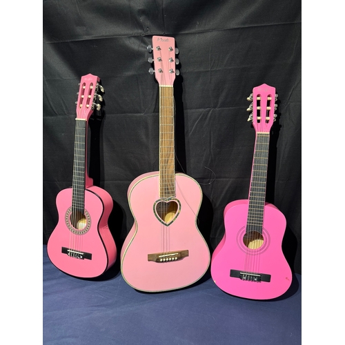 22 - Three children pink acoustic guitars