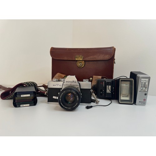 64 - Minolta SR T 101 35mm Camera with f/1.7 50mm lens, flashes plus filters in leather case