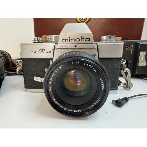 64 - Minolta SR T 101 35mm Camera with f/1.7 50mm lens, flashes plus filters in leather case