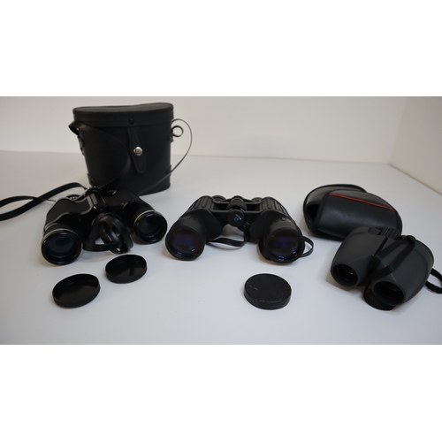 83 - Three sets of Binoculars - Pathescope 7 x 35, Opticron Classic 7 x 42, Praktica 10 x 25