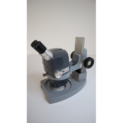 87 - American Optical AO 570 Stereo Star 0.7x to 4.2x Microscope
