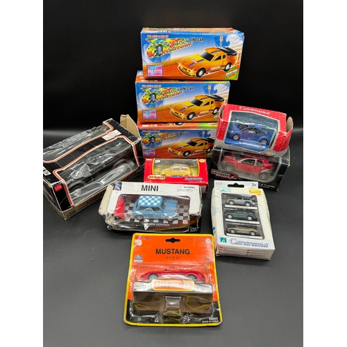 131 - A collection of boxed toy / models cars