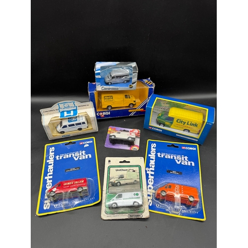 132 - A collection of Corgi Super haulers Transit Vans + others all boxed / carded