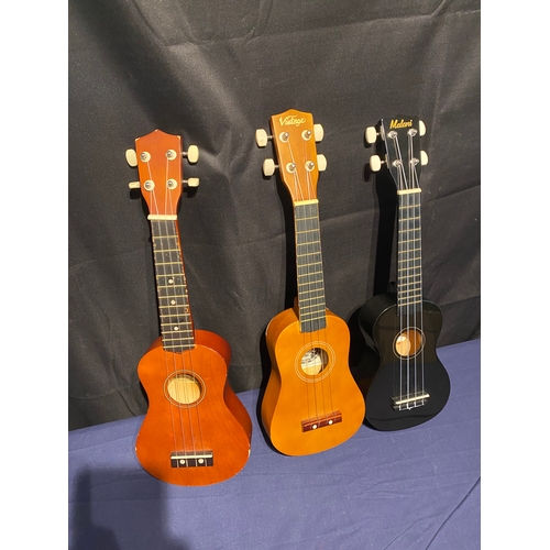 224 - Three Ukuleles including Vintage, Malani and C.Giant.