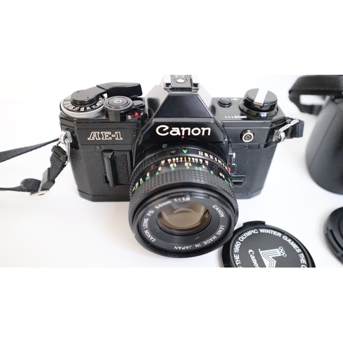 229 - Canon AE-1 SLR Camera w/ 50mm f/1.8 lens+ Canon EOS 1000F W/ 35-105M 1:4.5-5.6 Lens