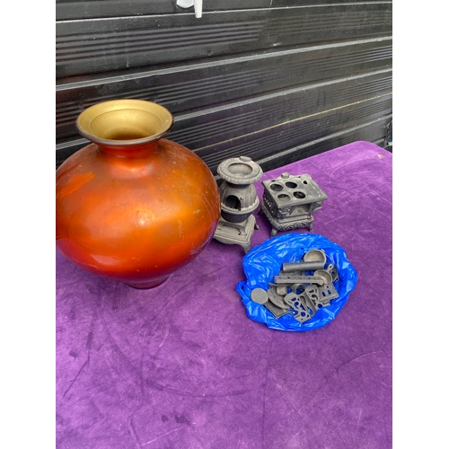 98 - An Orange vase and two vintage miniature cast iron wood burning stoves.