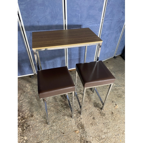 222 - A modern slimline chrome leg table and two stools.