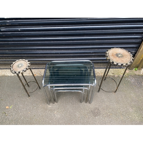 238 - A modern nest of three glass and chrome tables with A pair of metal plant stands.