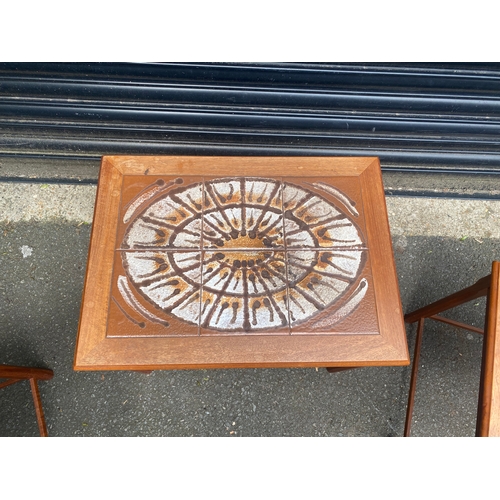 245 - Mid century teak tiled top nest of tables.