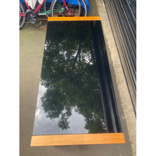 247 - Lovely teak and smoked black glass table.