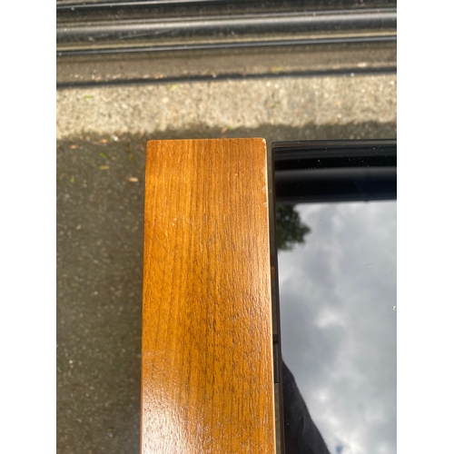 247 - Lovely teak and smoked black glass table.