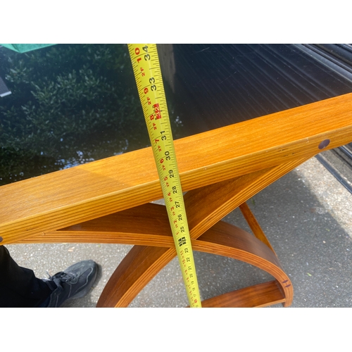 247 - Lovely teak and smoked black glass table.