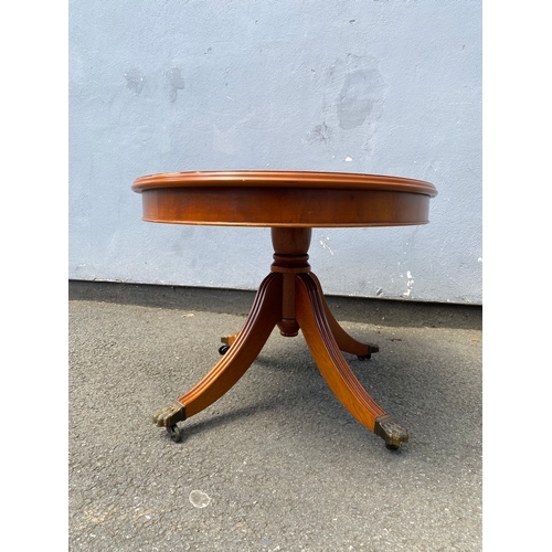 264 - Small oval inlaid tilt top coffee table.