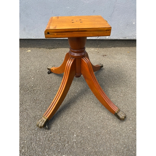 264 - Small oval inlaid tilt top coffee table.