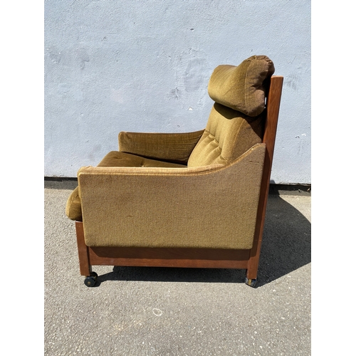 266 - Retro green upholstered armchair.