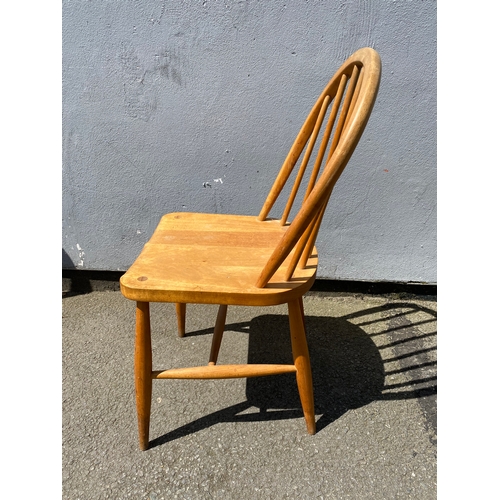 271 - A Mid century blonde Ercol chair and Antique ballon back mahogany upholstered chair.